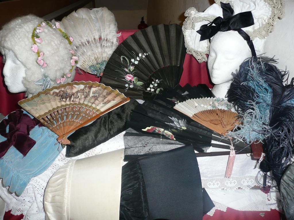 Appraisal: A group of fans including painted fabric feather and painted