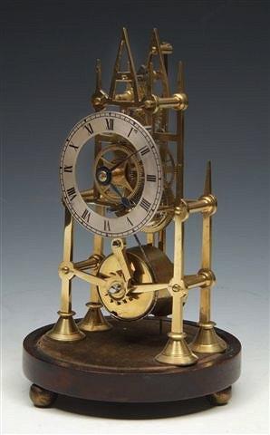 Appraisal: A SMALL BRASS 'STEEPLE' SKELETON TIME PIECE the single fusee