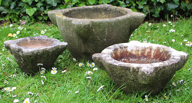 Appraisal: A GROUP OF THREE MARBLE MORTARS each with four lugs