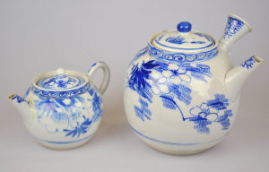 Appraisal: Two Chinese blue and white decorated teapots both decorated with