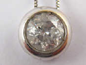 Appraisal: An carat white gold diamond solitaire pendant the round brilliant