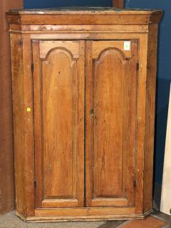 Appraisal: American Primitive corner cabinet early th century having a molded