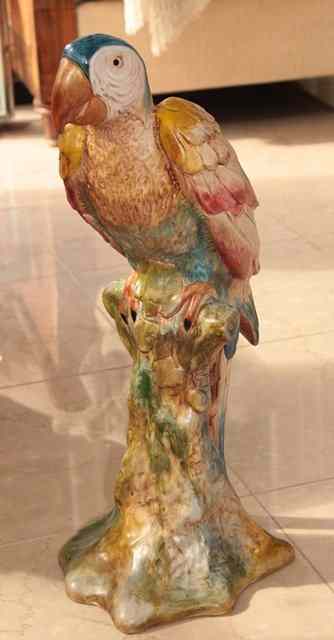 Appraisal: A POLYCHROME POTTERY FIGURE of a parrot high