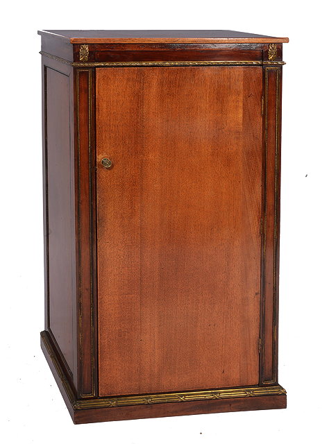 Appraisal: AN EDWARDIAN MAHOGANY AND GILT METAL MOUNTED LIBRARY CABINET the