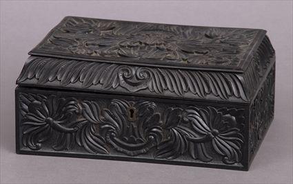 Appraisal: ANGLO-INDIAN CARVED AND EBONIZED BOX The rectangular molded hinged lid