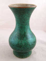 Appraisal: A Chinese green raku glazed ceramic baluster vase with everted