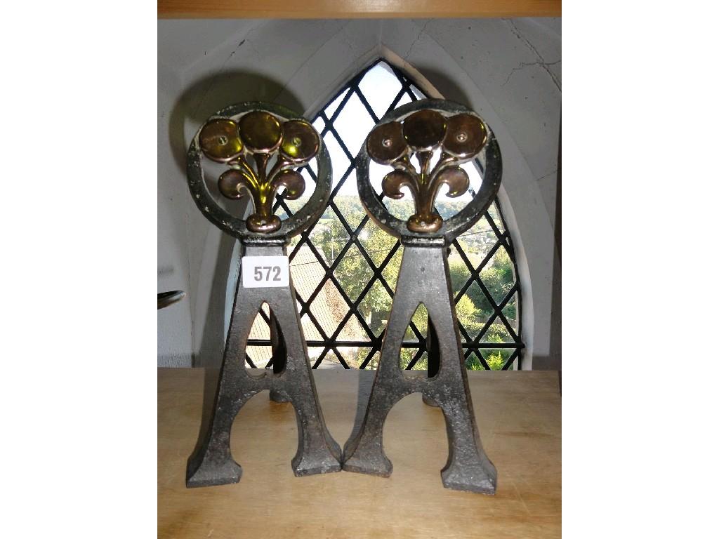 Appraisal: A pair of cast iron aesthetic movement fire dogs in