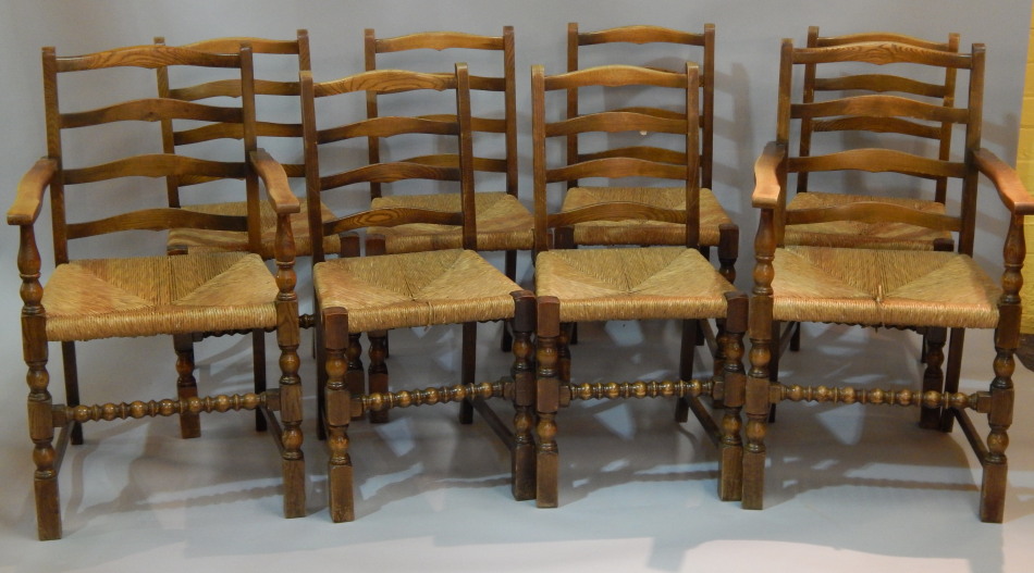 Appraisal: A set of eight oak ladder back dining chairs each