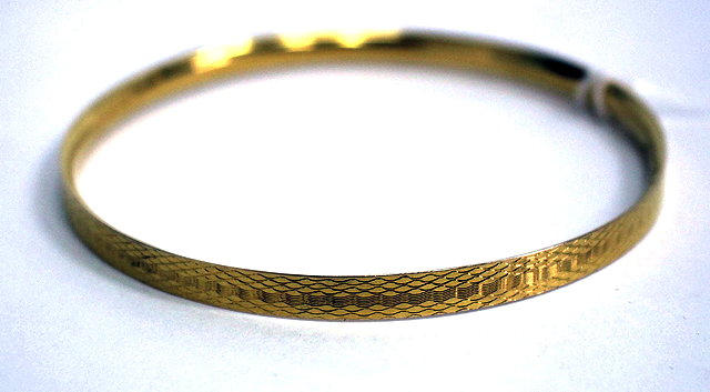 Appraisal: A CARAT GOLD BANGLE with marks for and makers mark