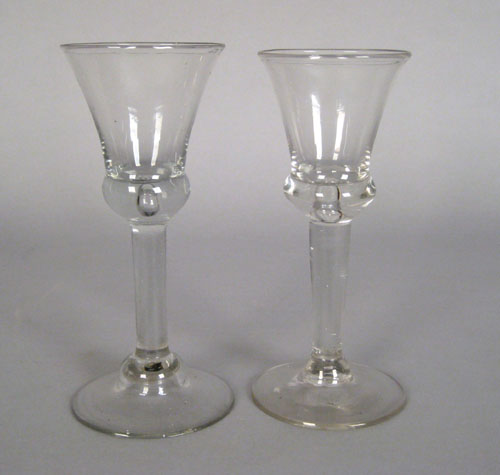 Appraisal: Pair of blown colorless wine glasses late th c h