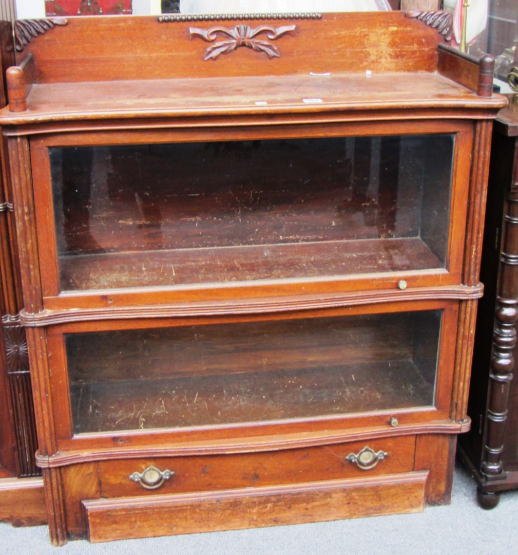 Appraisal: A Wernicke system 'Elastic' two tier bookcase of serpentine outline