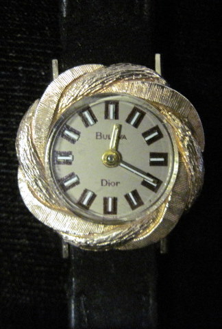 Appraisal: Lady's karat yellow gold wristwatch Bulova Circular cased tan enamel