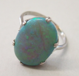 Appraisal: An opal set single stone ring claw set with an