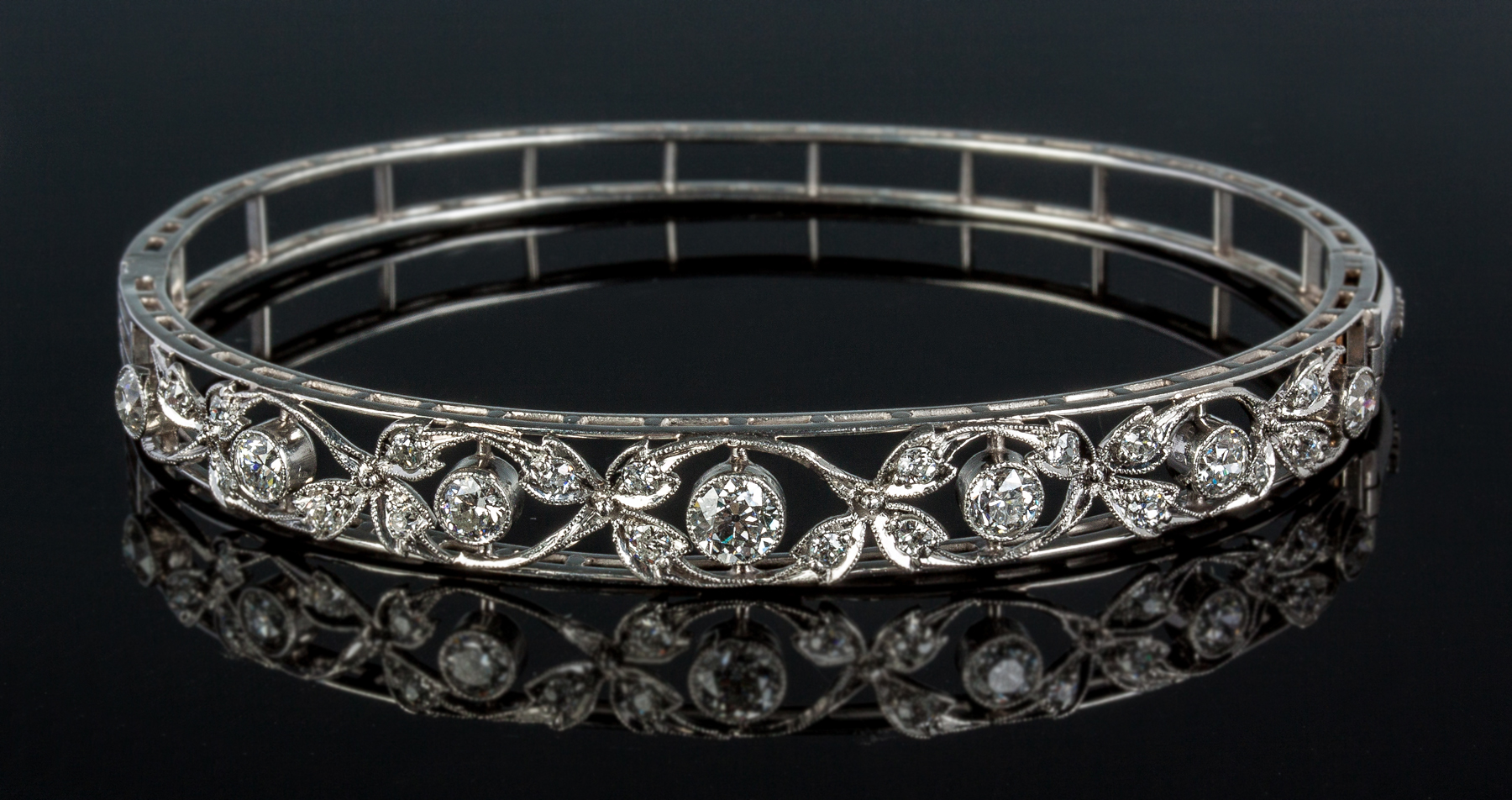 Appraisal: Platinum and Diamond Edwardian Era Hinged Bangle Bracelet Twenty five