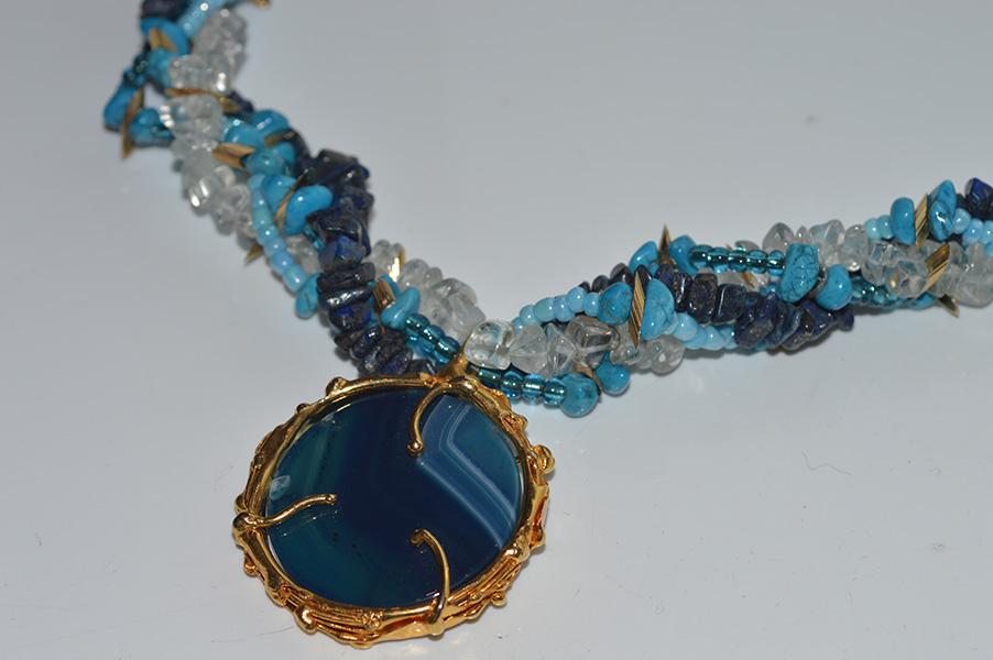 Appraisal: AN AGATE PENDANT ON MULIT STRAND GEM SET NECKLACE IN