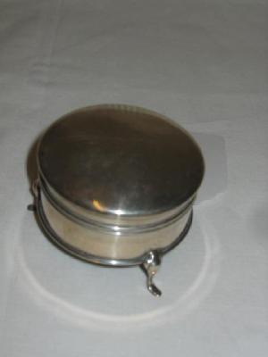 Appraisal: A JEWEL BOX of circular form with hinged lid raised