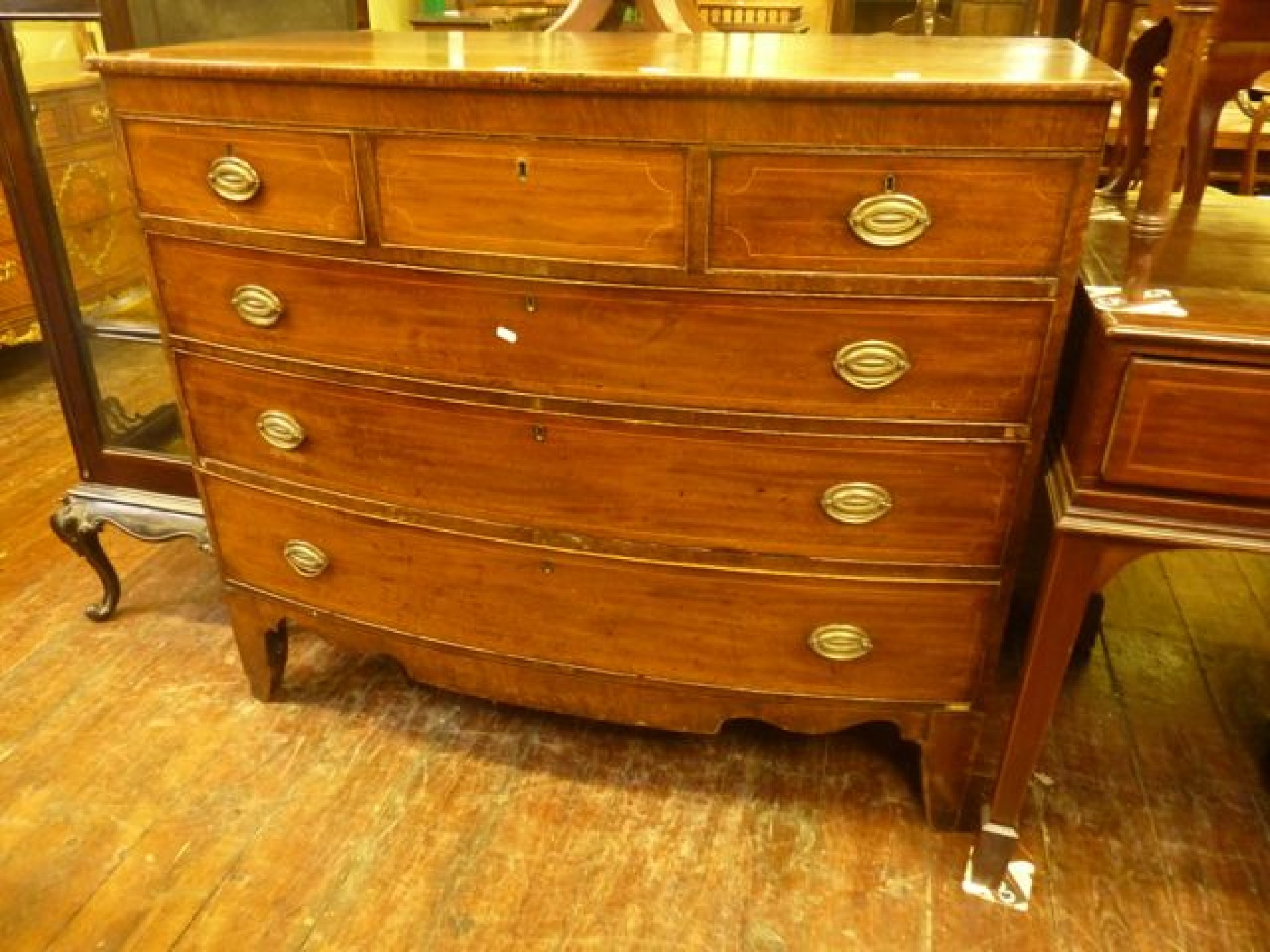 Appraisal: A substantial Georgian mahogany bow front bedroom chest of three