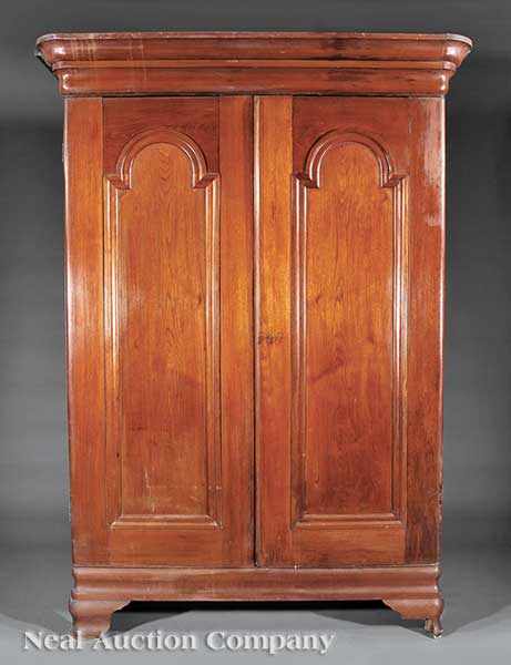 Appraisal: An American Classical Carved Walnut Armoire probably Louisiana or Mississippi