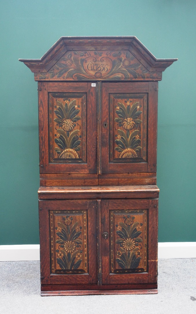 Appraisal: A th century North European painted pine cupboard the bonnet