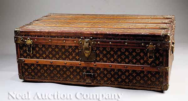 Appraisal: A Vintage Louis Vuitton Trunk with LV logo canvas lock