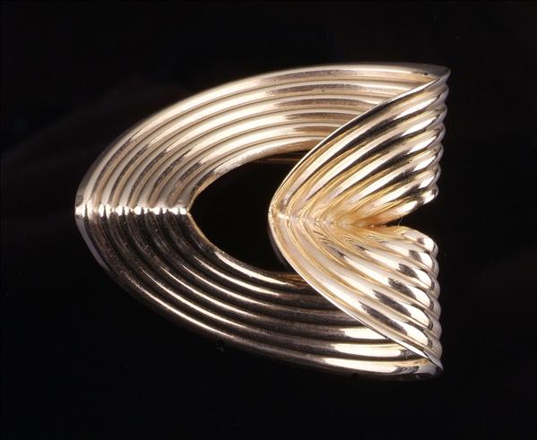 Appraisal: A clip brooch by Raymond Yard designed as a fluted