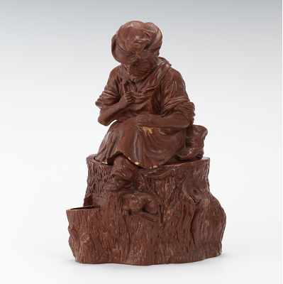 Appraisal: A Monochrome Figural Tobacco Jar of a Seated Cobbler on