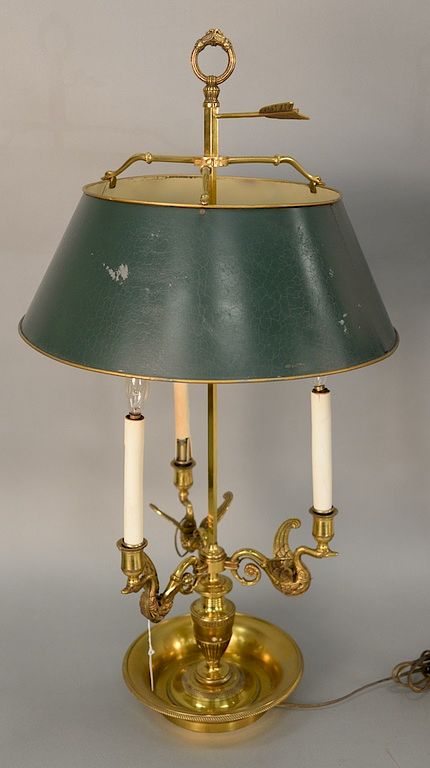 Appraisal: French brass bouillotte lamp having three lights with winged swan