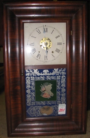 Appraisal: A MAHOGANY OGEE WALL CLOCK Seth Thomas Clock Co Thomaston