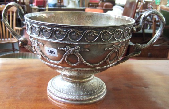 Appraisal: A silver large twin handled punch bowl the central band