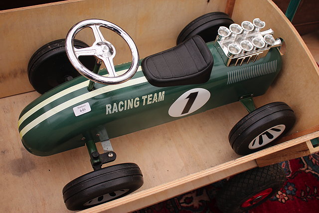 Appraisal: THE RACING TEAM' A RIDE ON TIN PLATE CHILD'S TOY