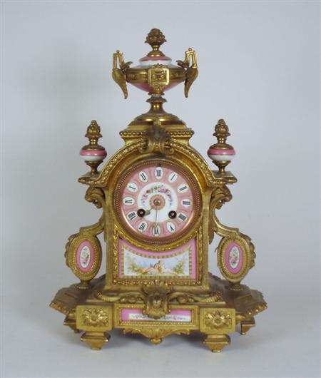 Appraisal: A late th century ormolu and pink porcelain mantel clock