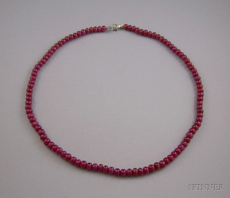 Appraisal: Single Strand of Tumbled Ruby Beads lg in