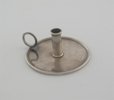 Appraisal: An unmarked chamberstick plain circular with a moulded rim to