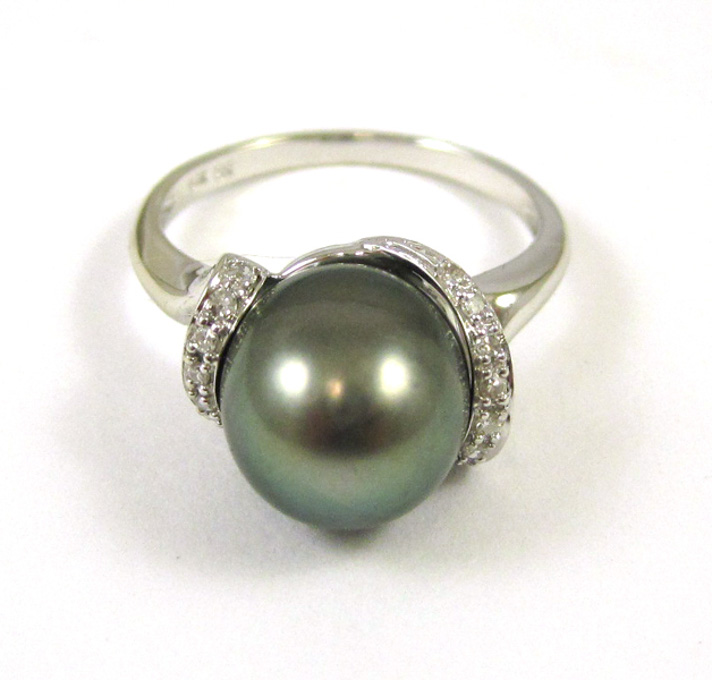 Appraisal: BLACK PEARL AND FOURTEEN KARAT WHITE GOLD RING with round-cut