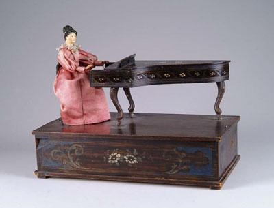 Appraisal: GERMAN AUTOMATON OF LADY AT PIANO A terrific automaton of