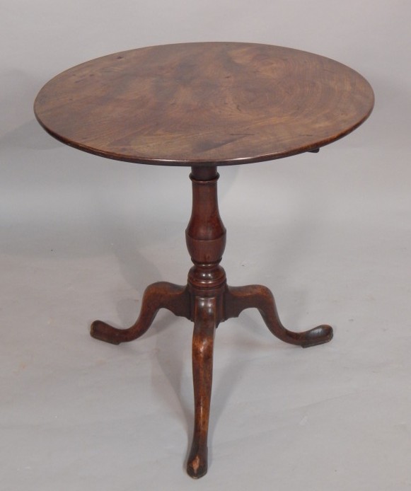 Appraisal: A George III mahogany tilt top table the circular top