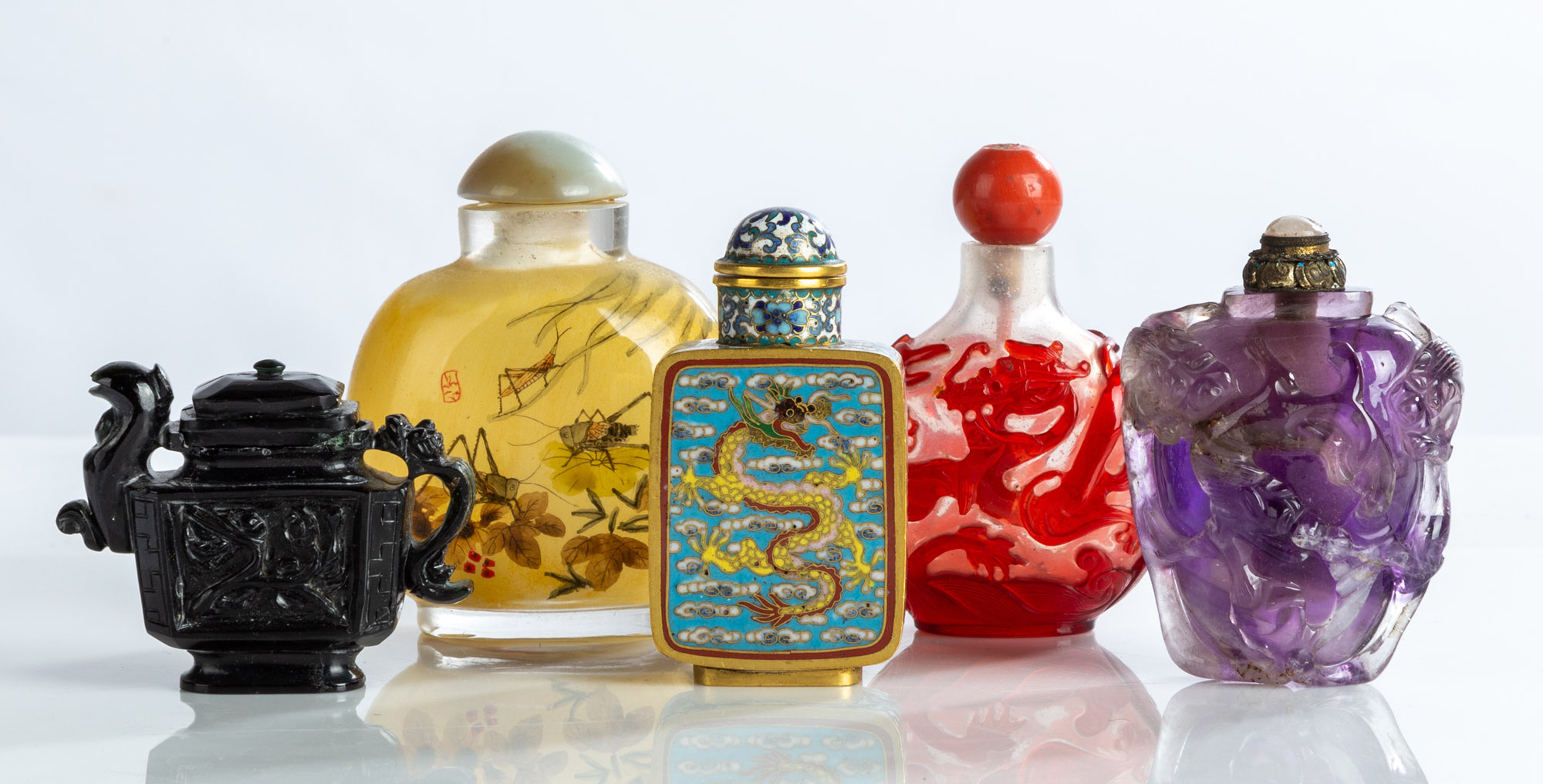 Appraisal: CHINESE SNUFF BOTTLES Reverse painted glass hardstone metal and enameled