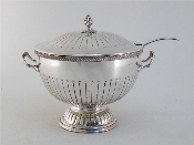 Appraisal: A silver-plated soup tureen or punch bowl fluted sides and