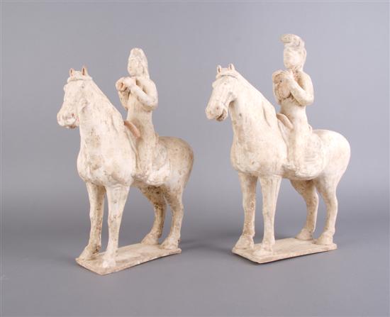 Appraisal: A Pair of Chinese Pottery Horses and Riders Height of