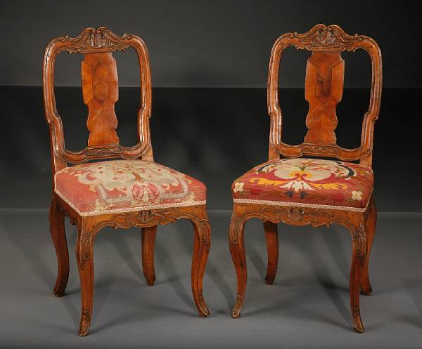 Appraisal: A pair of German Rococo inlaid walnut side chairs third