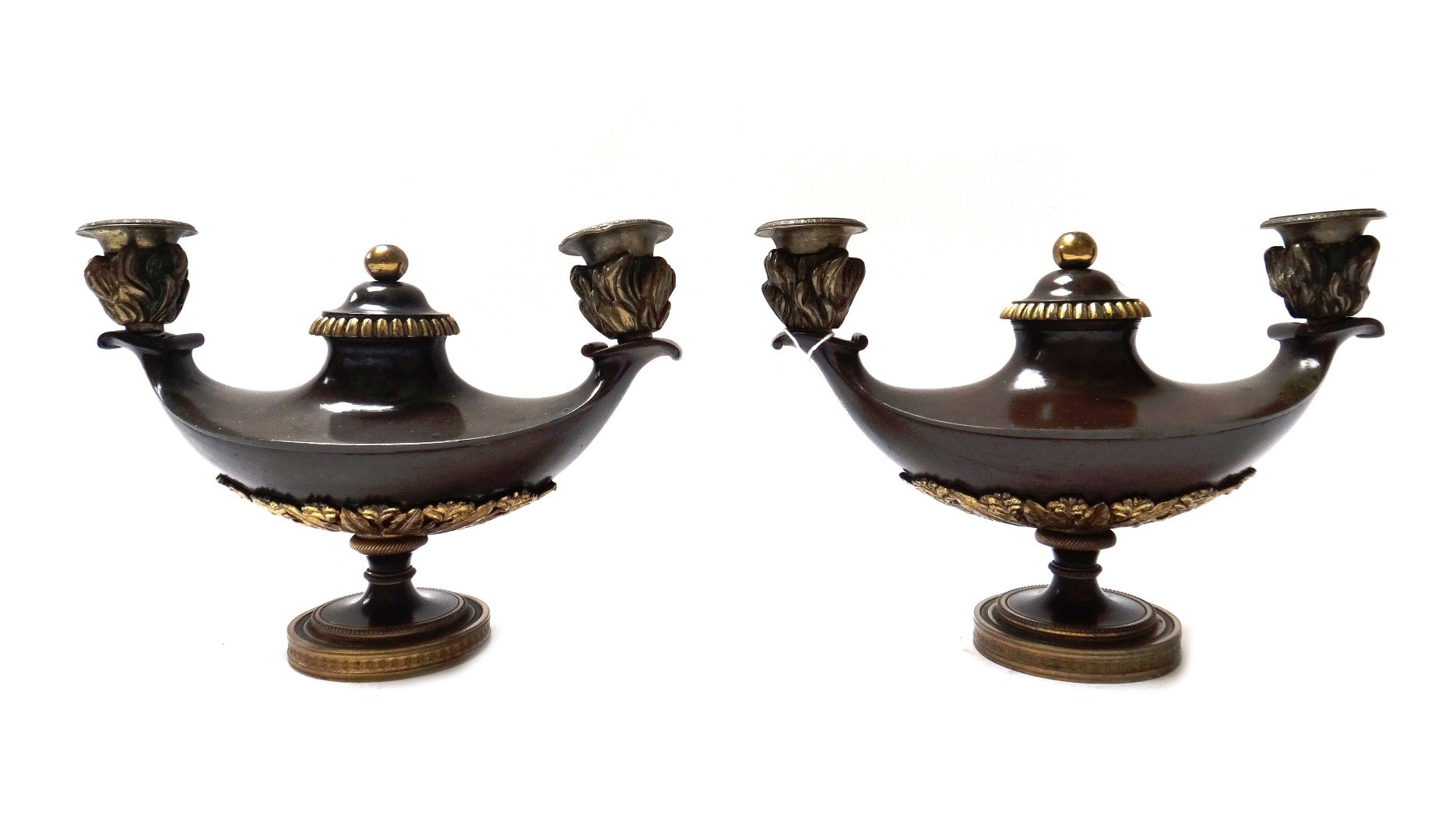 Appraisal: A pair of Empire style patinated bronze twin branch candelabra