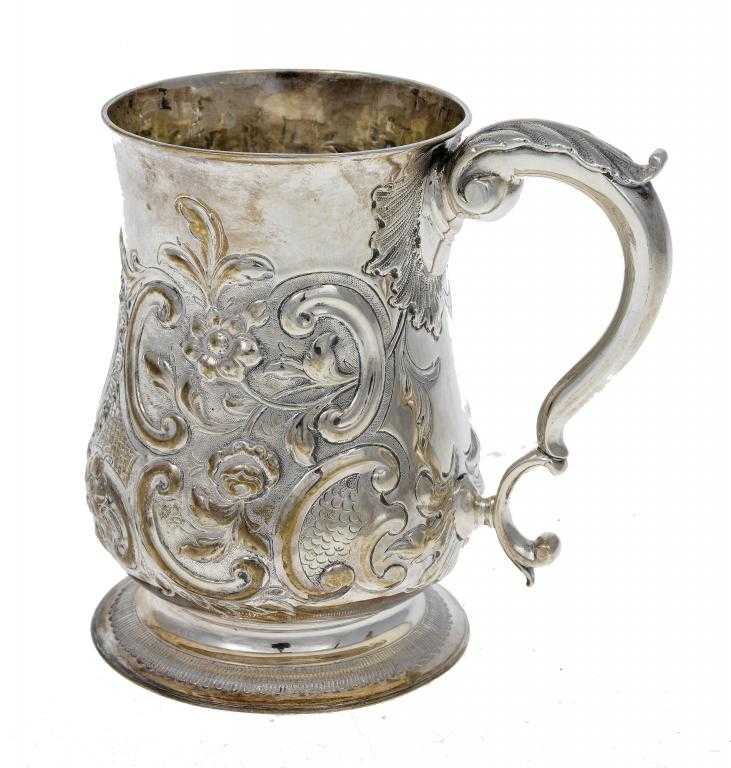 Appraisal: A GEORGE II MUG of baluster shape later chased with