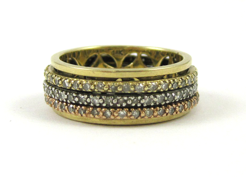 Appraisal: DIAMOND AND MULTI-TONE GOLD RING having a pierced yellow gold