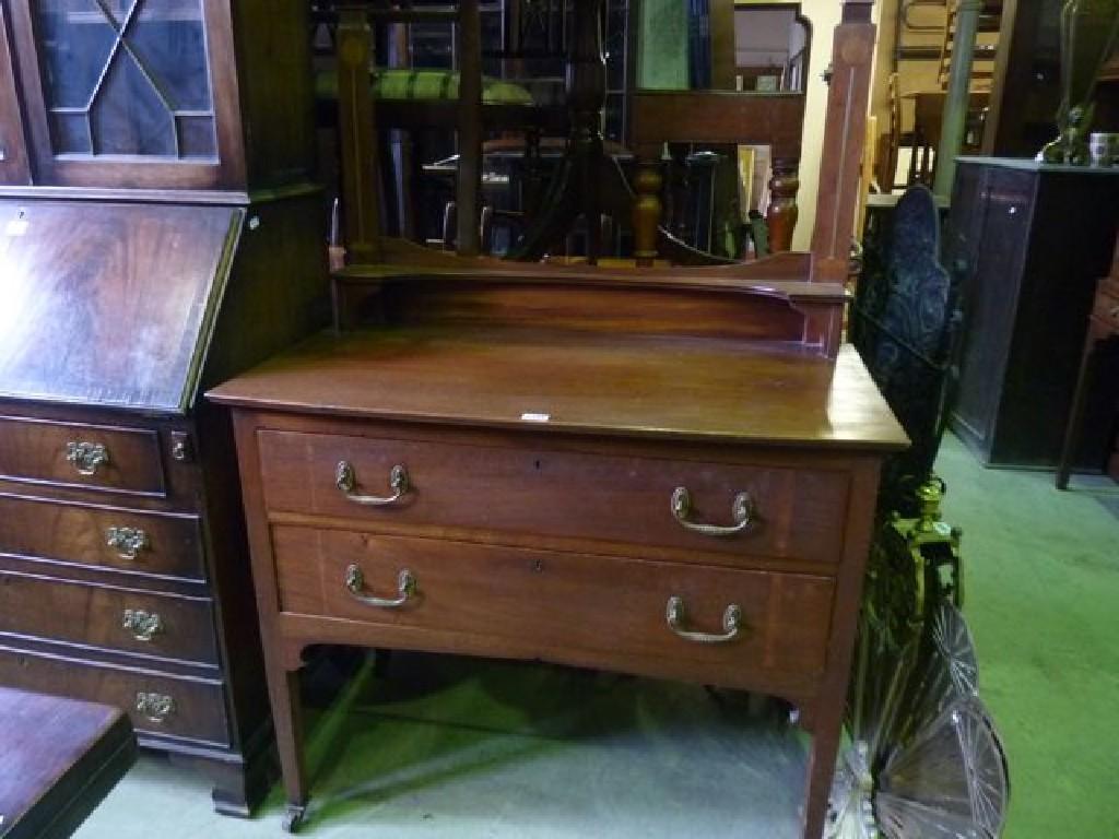 Appraisal: An Edwardian mahogany dressing table with inlaid Art Nouveau floral