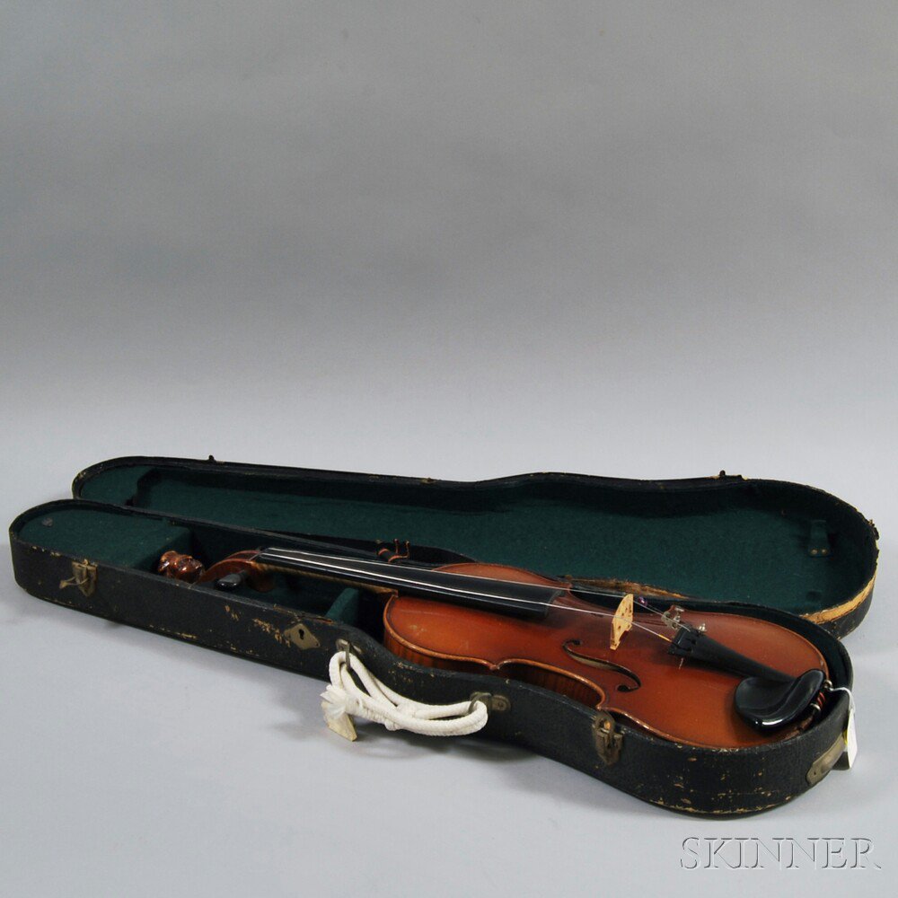 Appraisal: Cased Carved Violin th century the pegbox topped by a