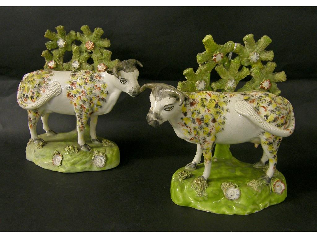 Appraisal: Pair of early th century Staffordshire bocage cows the bodies