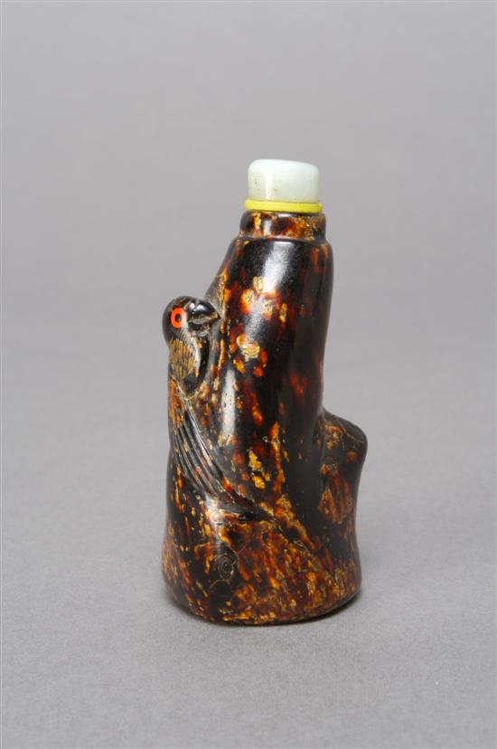 Appraisal: A Chinese Amber Tree Trunk Form Bottle Height inches