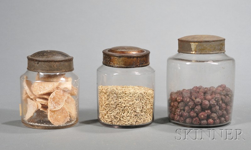 Appraisal: Three Small Blown Colorless Glass Cannisters with Tin Lids America