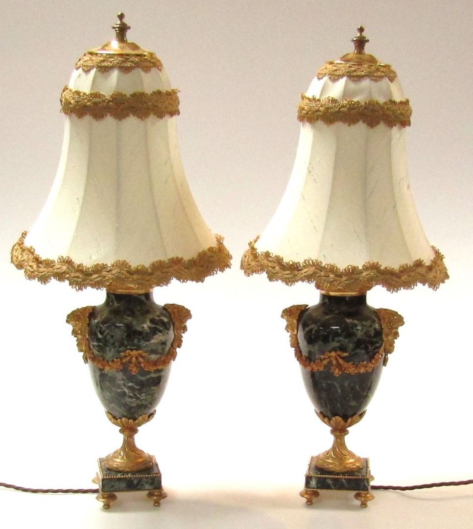 Appraisal: A pair of thC black marble baluster table lamps with