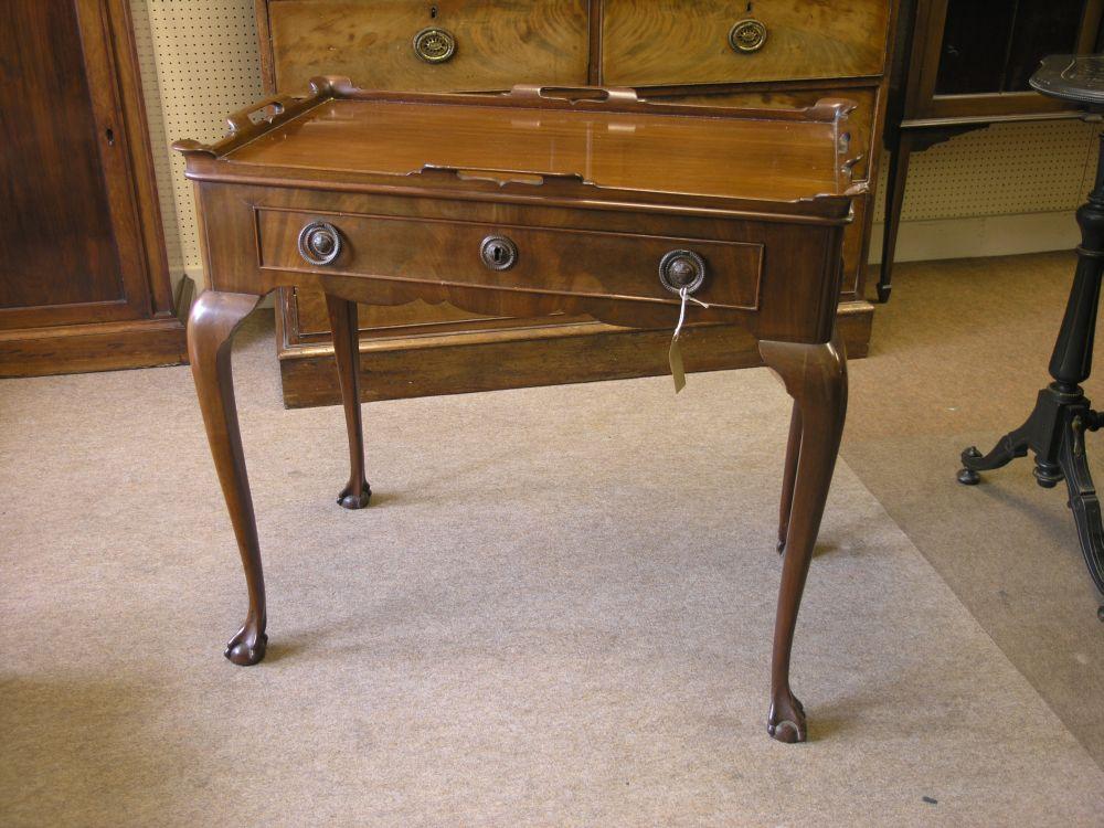 Appraisal: A th century Dutch mahogany silver table tray top above